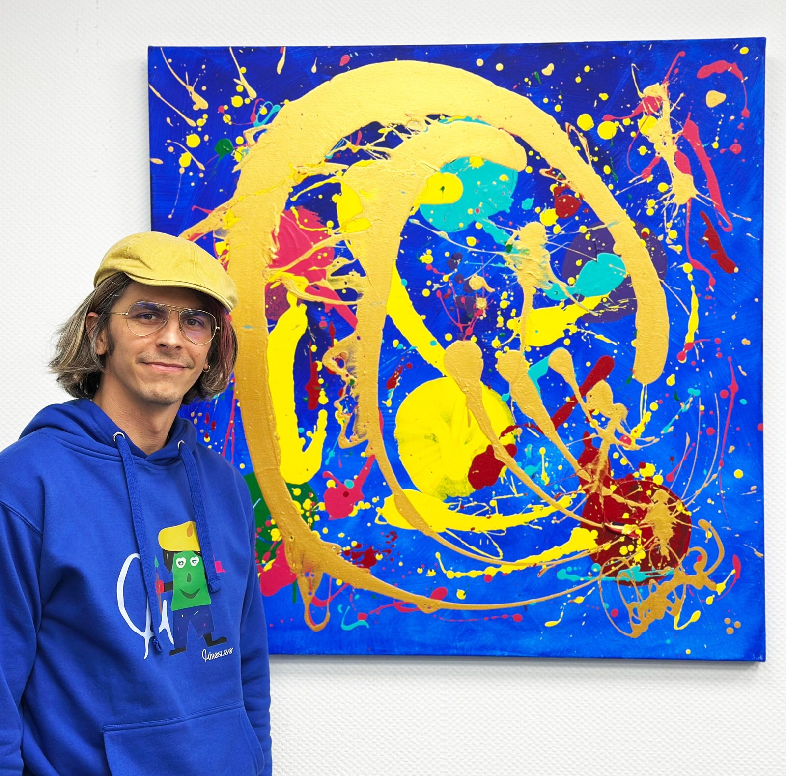 Blue abstract painting with artist, dynamic colours and movement